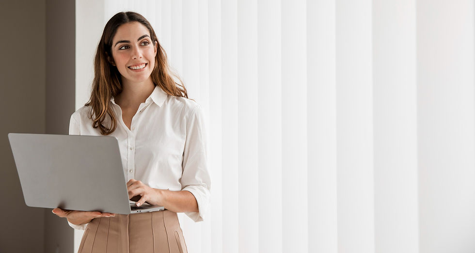 front-view-smiley-elegant-businesswoman-using-laptop-with-copy-space (1)_edited.jpg