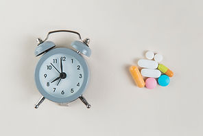 top-view-alarm-clock-with-medicine-table.jpg