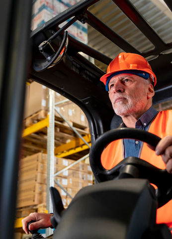 man-driving-warehouse-loading-machine.jpg