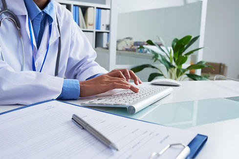 hands-unrecognizable-female-doctor-typing-keyboard-office.jpg