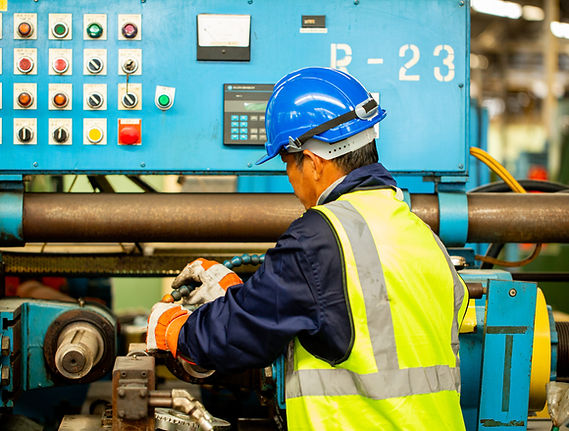 worker-adjust-machine-before-start-operation-teachnician-staff-with-safety-suit-setting-pr