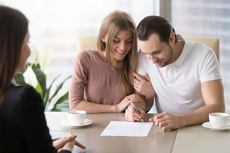 smiling-couple-agreed-sign-prenuptial-contract-handsome-man-putting-signature-document-whi