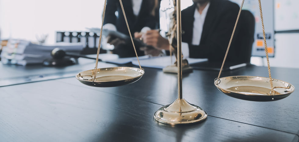 business-lawyers-discussing-contract-papers-with-brass-scale-desk-office-law-legal-service