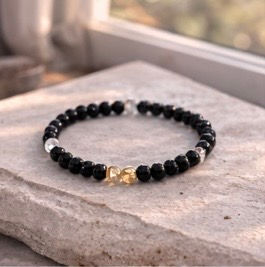 obsidian bracelet on stone block by window