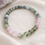Thumbnail: close up of labradorite bracelet resting on a neutral linen background