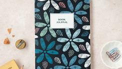 Navy book review journal with floral pattern