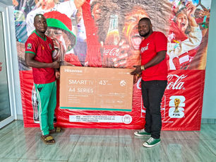 A man receiving a Smart TV Prize