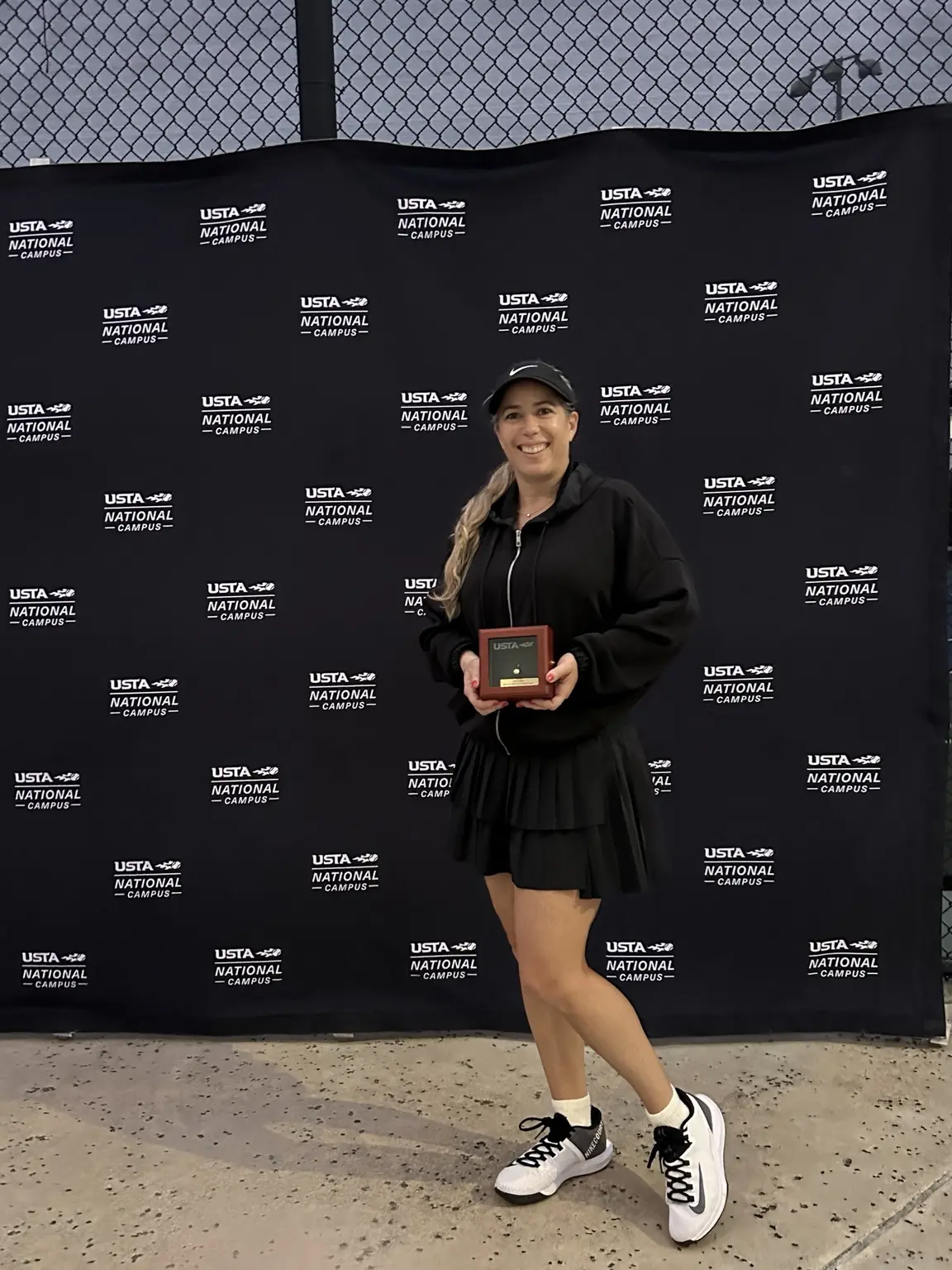 Mariana Correa receiving recognition at the USTA National Campus
