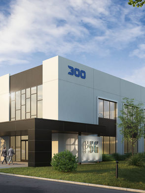 Modern office building, tilt up concrete construction, curtain wall, and aluminum composite panel
balconies.