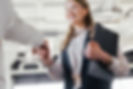 Woman shaking hands with colleague.