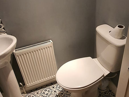 Small toilet tiled. Happy customers.