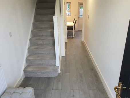 Removed old door frame,plastered and painted.Ripped out old flooring and newlaminate flooring layed