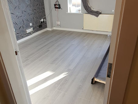 Fitted laminate flooring. Happy customer.