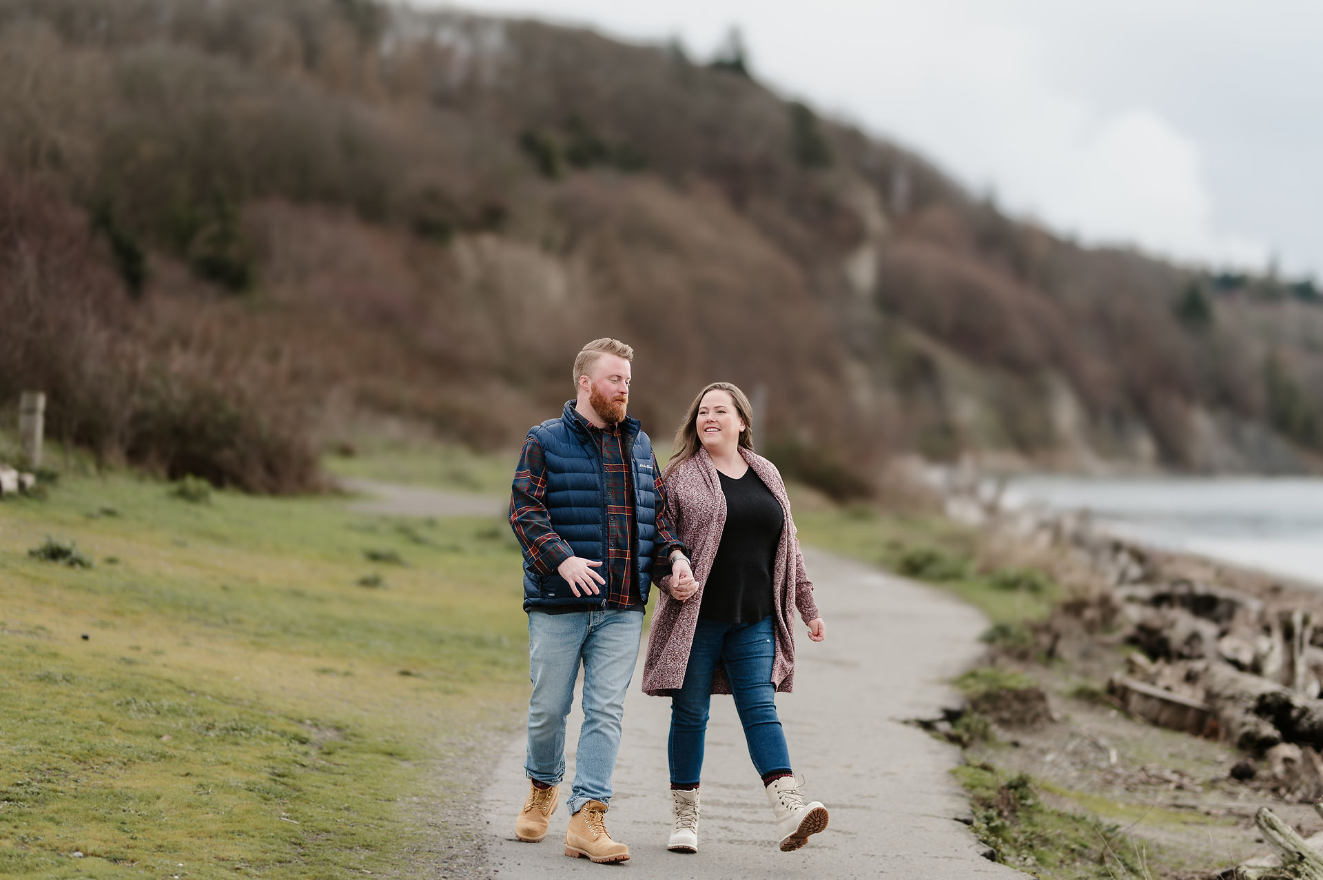 Couple laughs by the crashing waves