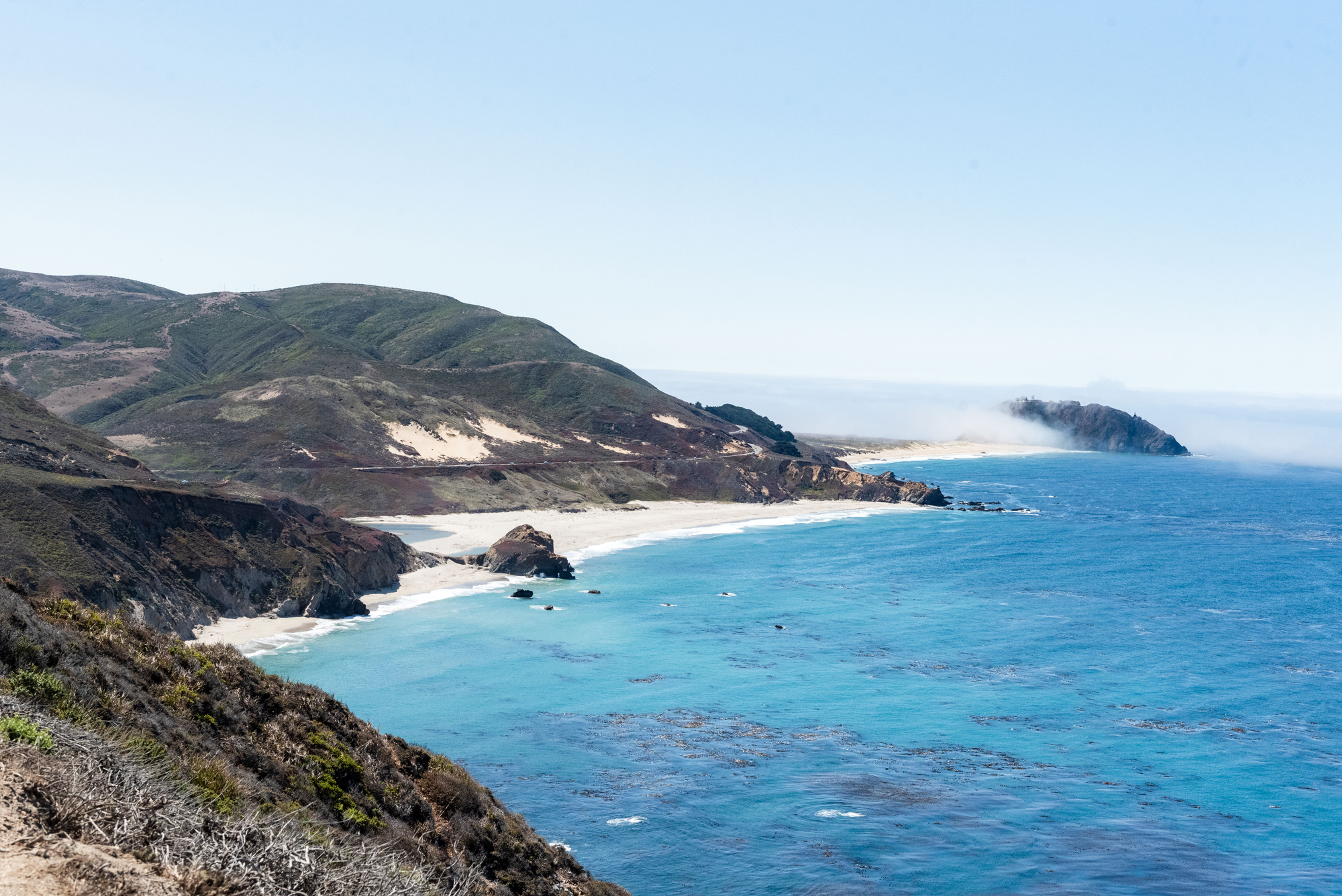 Coastal Bliss: Where Mountains Meet Blue Horizons