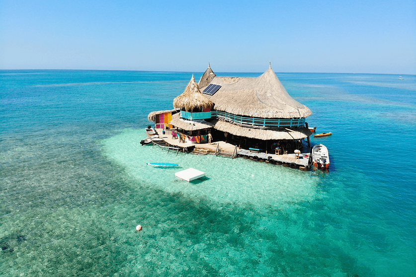 Island lodge surrounded by turquoise Caribbean water in the Rosario Islands near Cartagena.