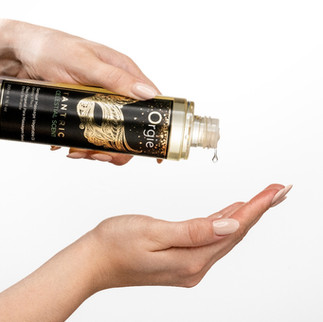 close up image of a lady pouring lube on to her hand