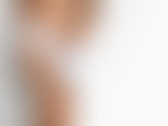 a healthy woman with a white towel standing against a white background