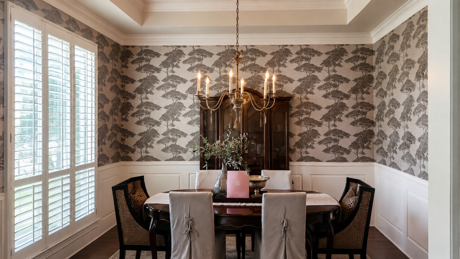 Scenic Dining Room. Traditional scenic wallpaper above white wainscoting.