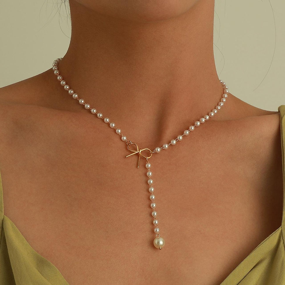 Thumbnail: Bow and pearl necklace