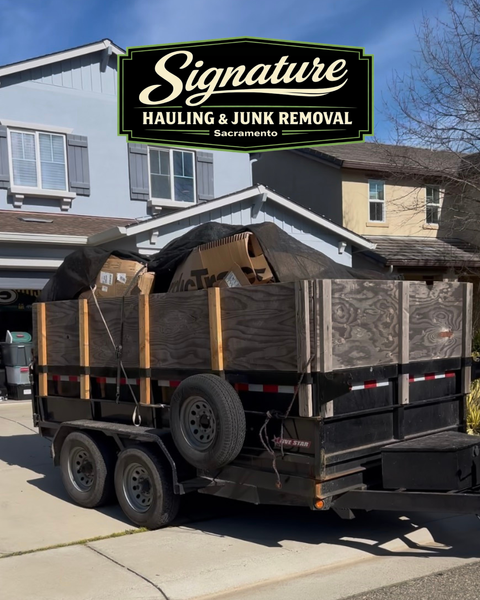 Residential junk removal trailer loaded with furniture by Signature Hauling & Junk Removal in Sacramento California