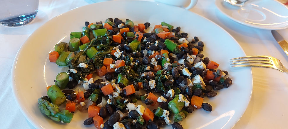 plate with cooked asparagus, black beans, carrot, tofu