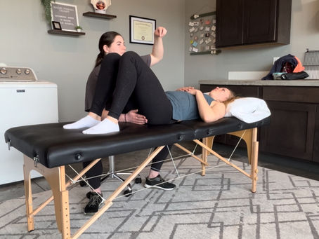 Pelvic floor therapist assessing a woman's pelvic floor