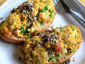 Tofu scramble on toasted sourdough topped with Cashew Parmysan and Sesame Crunch CRUMS