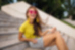 young attractive stylish smiling woman having fun in city park, positive, emotional, long