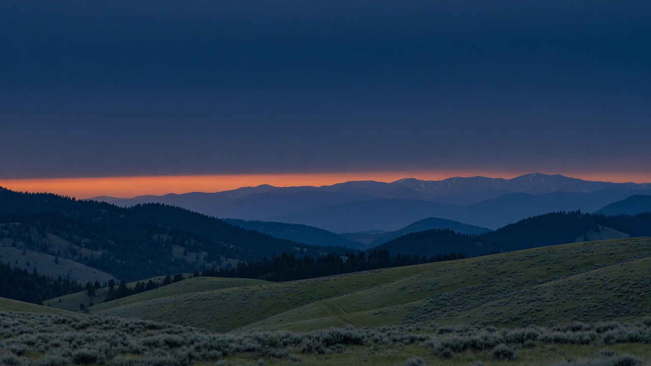 Montana foothills under a wide dusk sky