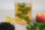 Cold brew iced tea in a jar with lemon and mint, shown above a section on how to make iced tea.