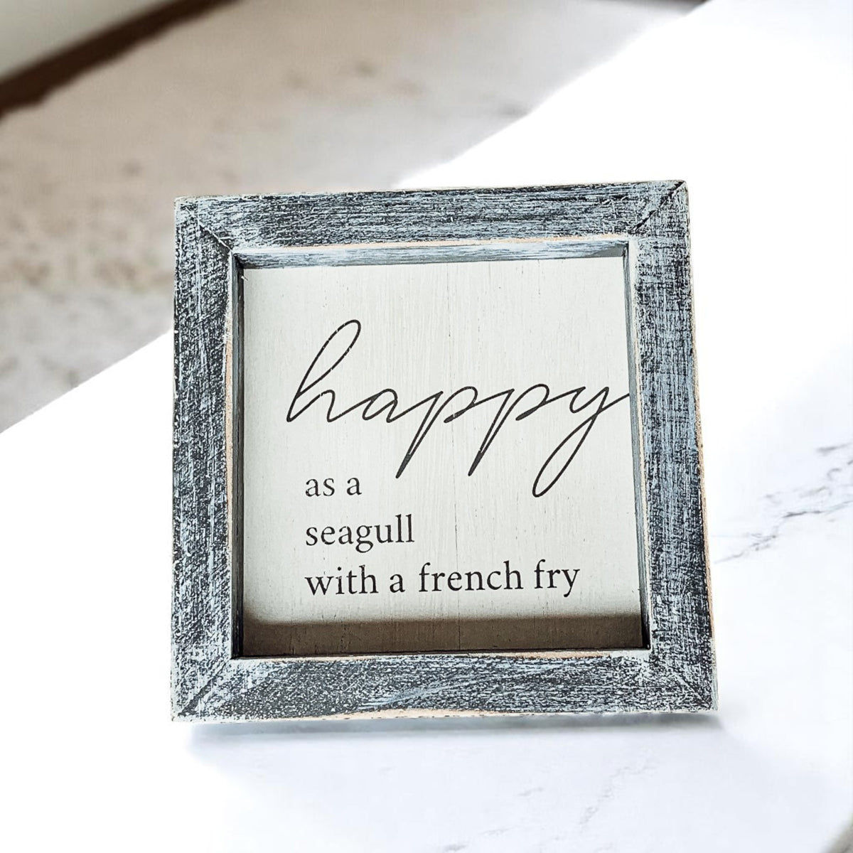 Square wooden sign with “Happy as a Seagull” text – funny beach house decor with distressed gray frame
