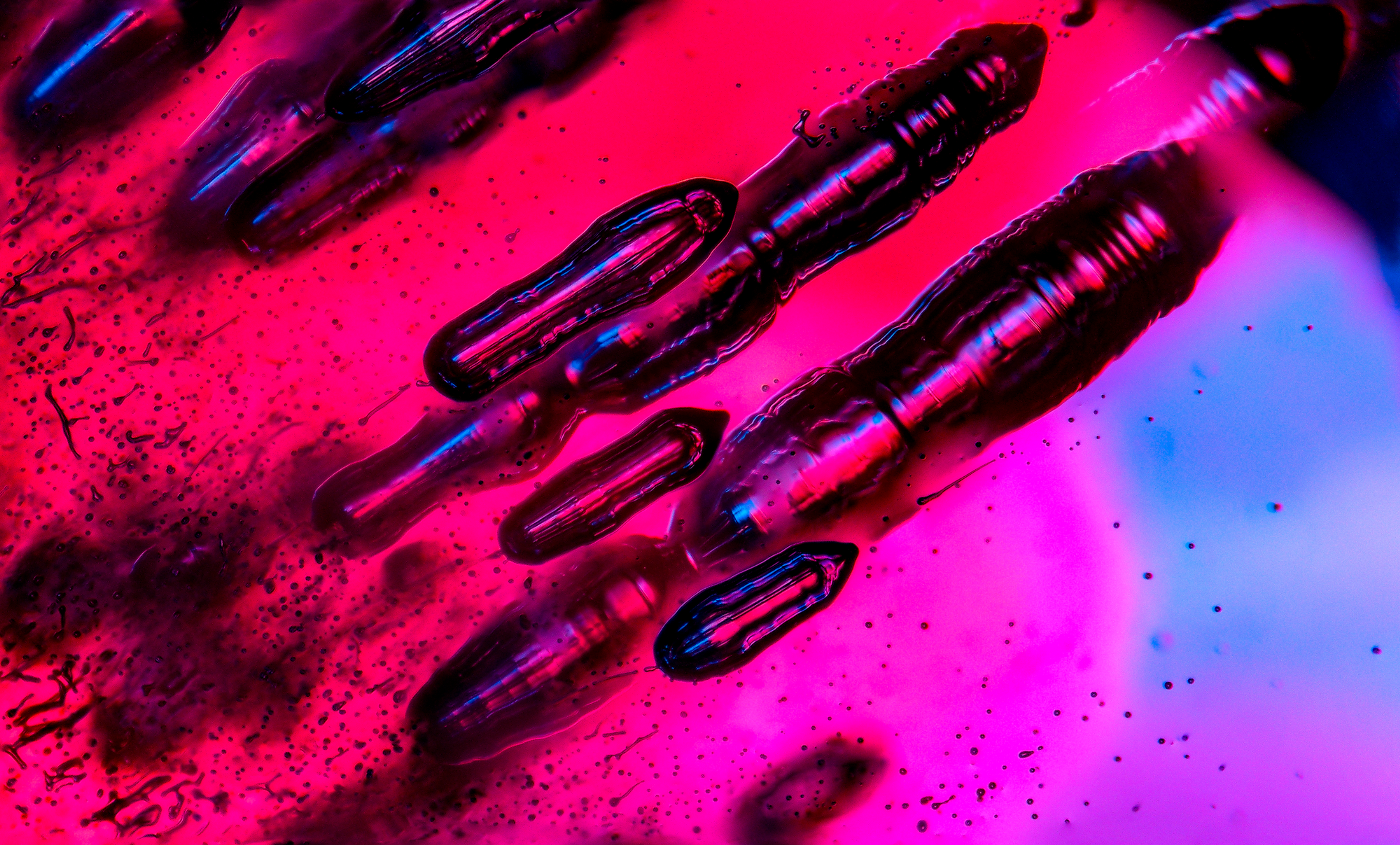 Gas bubbles in a Verneuil synthetic ruby.