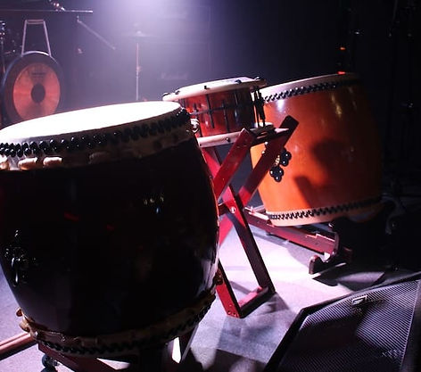 Traditional Japanese taiko drums on stage prepared for a taiko workshop experience in Kyoto Japan