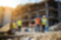 Four-construction-workers-having-meeting-scaled.jpeg