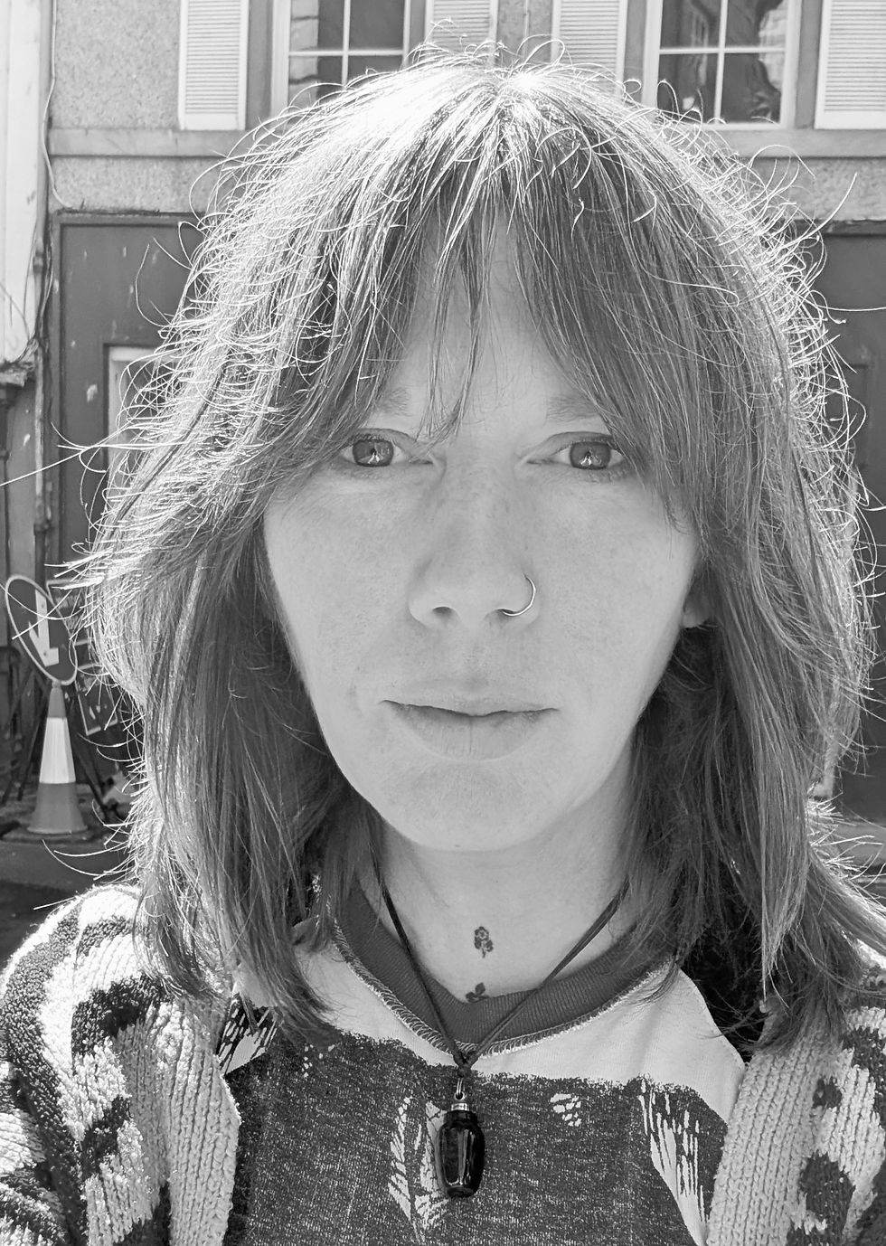 Black and white headshot of Mandy Lee.