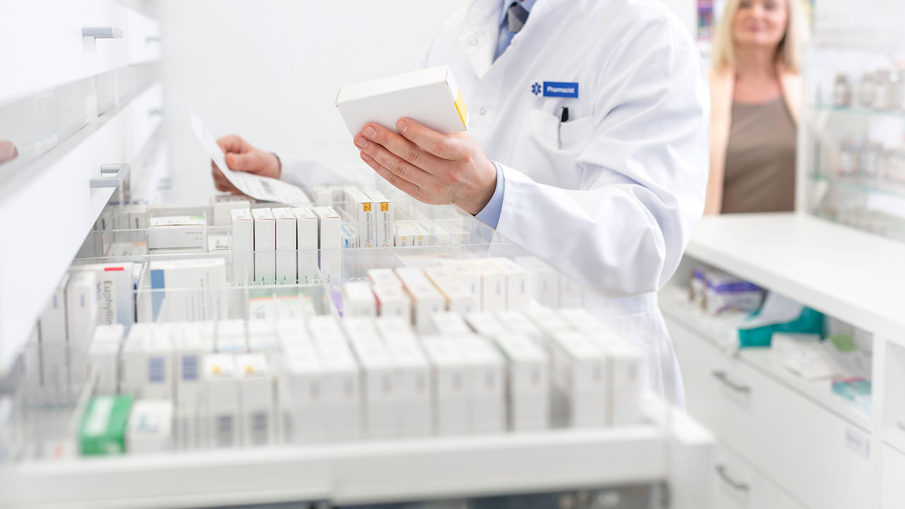 Pharmacist organizing medications