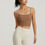 Thumbnail: Woman wearing the DualTone Semi-Fixed Cup Fitness Tank in brown with white biker shorts.