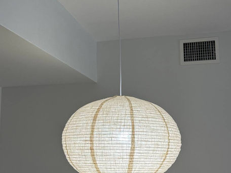 Globe pendant light fixture installed on a ceiling