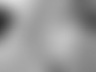 Black and white photo of a baby's hand in an adult's hand