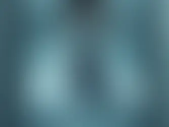 Image of doctor behind shattered mirror.