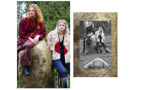 Two models sat on a rock