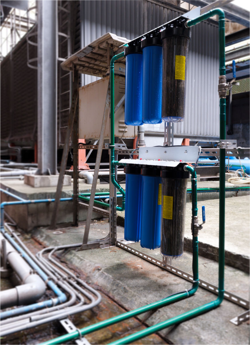 Rainwater is pumped from the basement storage tank through the green pipes, where it undergoes a final filtration process before being fed into the cooling towers.