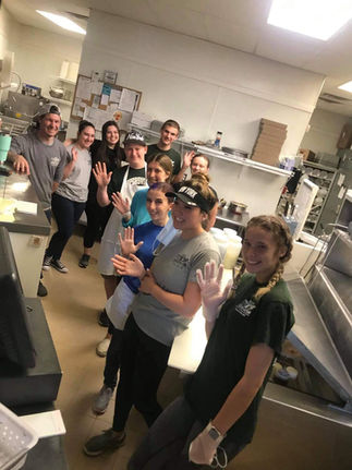 Happy 327pizzapub team in kitchen