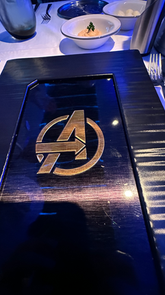 Avengers Symbol on Menu in Worlds of Marvel Menu on board Disney Wish Class Ships