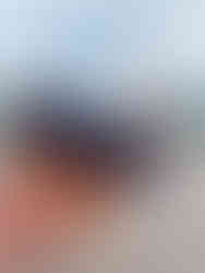 Mickey Mouse Shaped Rice Krispie Treat with Disneyland Paris castle in the background