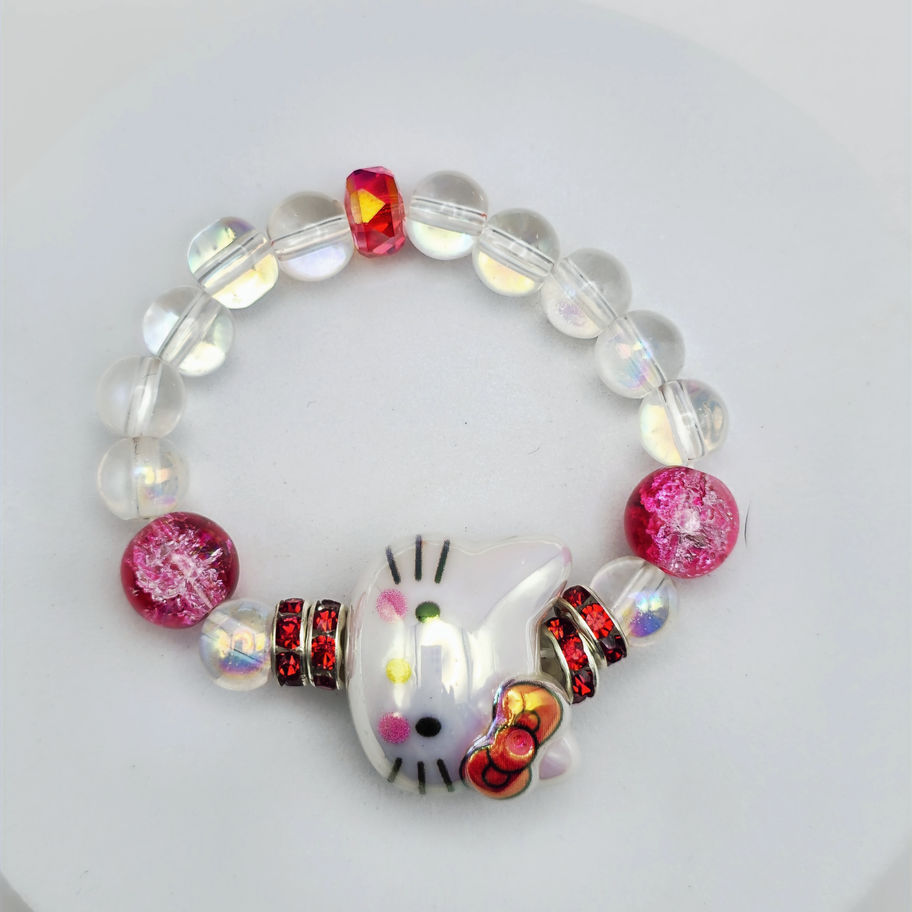Handcrafted kids clear aura beaded bracelet with red crackle glass beads, red rhinestone spacers, and a pearlized kitty charm