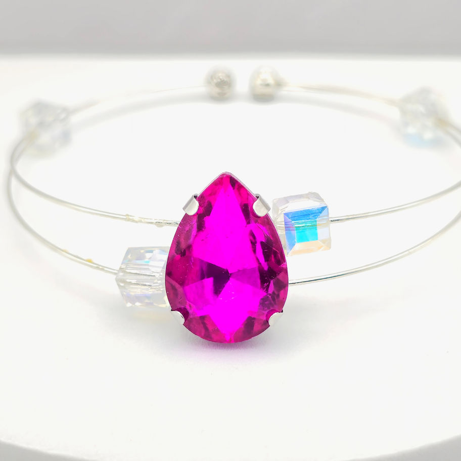 Handcrafted double silver wire bangle with a large hot pink teardrop crystal center & iridescent cube crystals