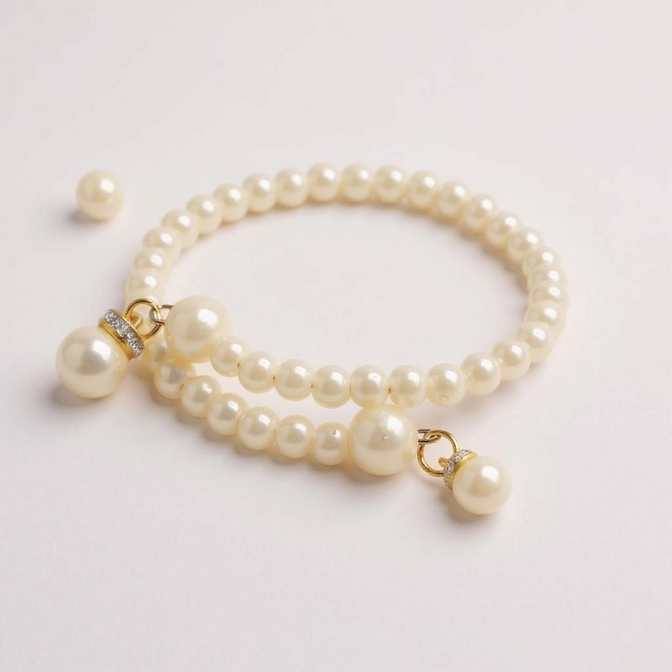 Elegant pearl bracelet with small charms