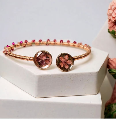 Handcrafted rose goldl cuff bracelet with real pressed flower pendants and pink beads.